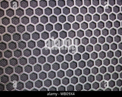 Modern acoustic systems. Metal grating on the sound dynamics. Abstraction and background. Soft focus and beautiful light. Stock Photo