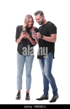 in full growth. stylish young couple with smartphones Stock Photo