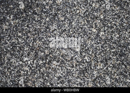 Black stone wall texture. Granite slab surface. Abstract background, quartz pattern. Grunge gray tile. Copy space. Stock Photo