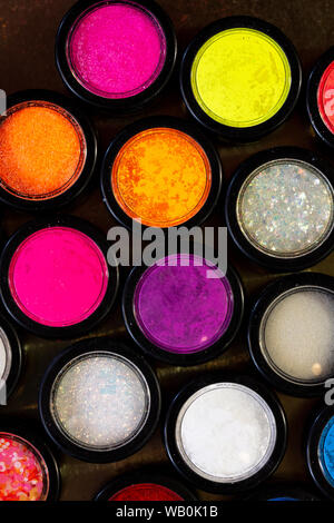 multicolor glitter used for mails art and photographed from above Stock Photo