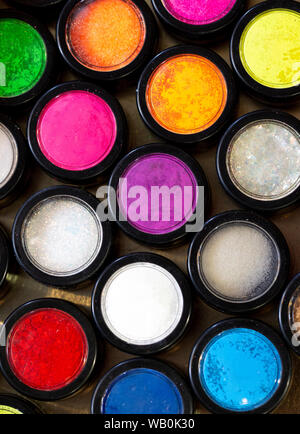 multicolor glitter used for mails art and photographed from above Stock Photo