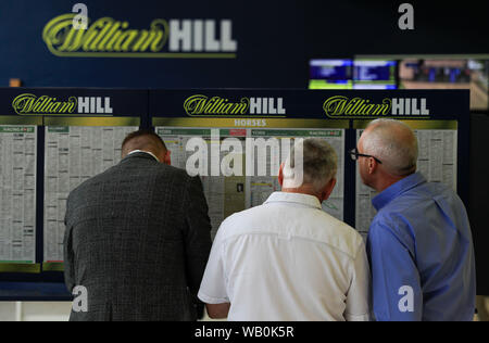 22nd August 2019 , York Racecourse, York, Great Britain; 2019 Darley Yorkshire Oaks/Ladies Day ; Punters analysing the form Credit Conor Molloy/News Images Stock Photo