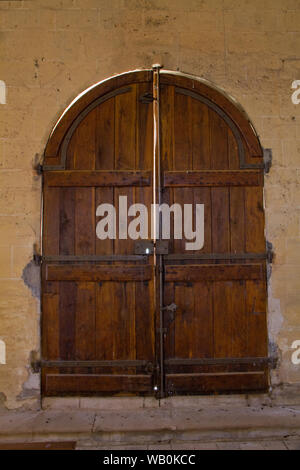 Old wooden church door, medieval building Stock Photo