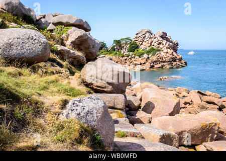 The Pors Rolland point on the Pink Granite Coast in northern Brittany, France, is a famous place in the pink granite blockfield of Ploumanac'h. Stock Photo