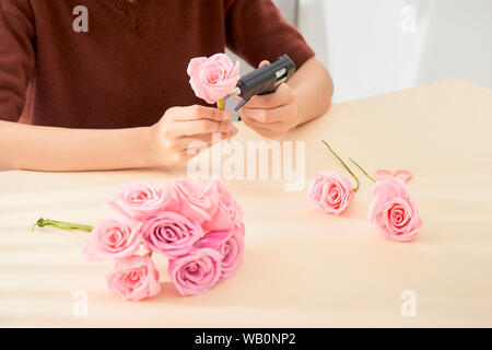 People making paper craft flower art Stock Photo