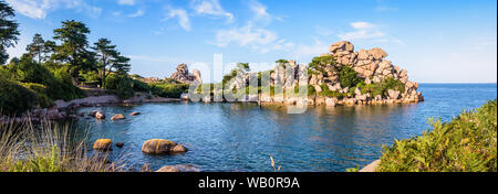 Panoramic view of the Pors Rolland creek on the Pink Granite Coast in Brittany, an idyllic rocky beach in the pink granite blockfield of Ploumanac'h. Stock Photo