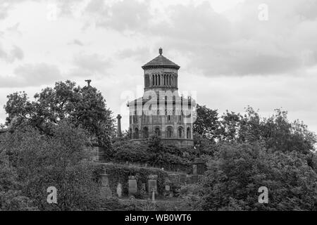 Impressive Ancient Glasgow architecture looking over to the Necropolis sitting high on the cemetery hill surrounded by trees Stock Photo