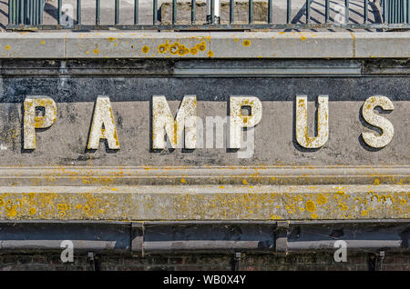 Muiden, The Netherlands, August 21, 2019: letters covered with dirt and lichen spelling the name of the artificial fortress island of Pampus, part of Stock Photo