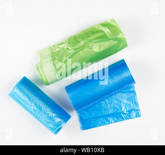 three rolled up rolls with plastic garbage bags on a white background Stock Photo