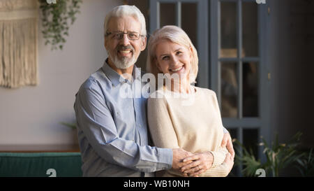 Happy old senior retired family couple bonding posing for portrait Stock Photo