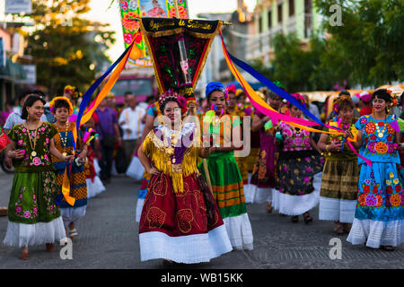 Mexican women of Zapotec origin, wearing traditional Tehuana dress, take part in the festival in Juchitán de Zaragoza, Mexico. Stock Photo