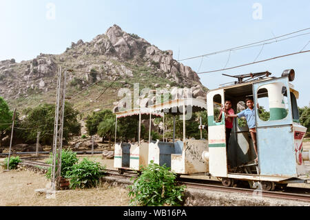 Khandoli Park, Giridih, Jharkhand, India May 2018 - Kids enjoying an Amusement Park Toy Train ride while nicely posing to the photographer. Kid Poses Stock Photo