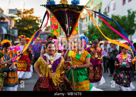 Mexican women of Zapotec origin, wearing traditional Tehuana dress, take part in the festival in Juchitán de Zaragoza, Mexico. Stock Photo