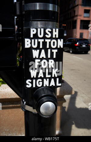 push button for walk signal at crosswalk in downtown chicago illinois ...