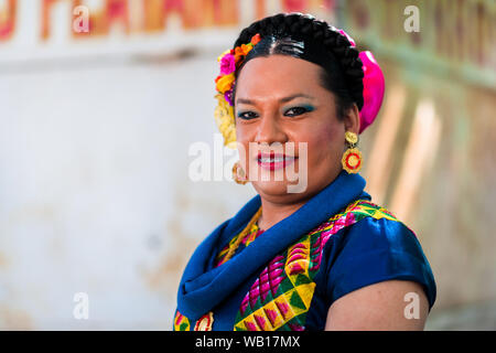 A Mexican “muxe” (typically, a homosexual man wearing female clothes) poses for a picture during the festival in Juchitán de Zaragoza, Mexico. Stock Photo