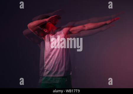 Portrait of a young hip hop dancer man who does a cool pose. Double exposure photo Stock Photo