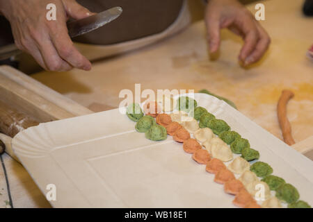 Preparation of Homemade Italian Pasta Orecchiette in different Colors. Stock Photo