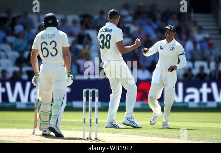 England's Jos Buttler (left) reacts after being caught out by Usman Khawaja (right) during day two of the third Ashes Test match at Headingley, Leeds. Stock Photo