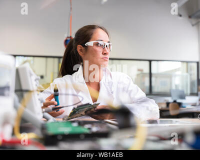 Female technician working in research laboratory Stock Photo