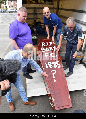 Bury fans deliver a symbolic coffin reading 'R.I.P Bury F.C. 1885 ?' at Gigg Lane, home of Bury FC. Stock Photo