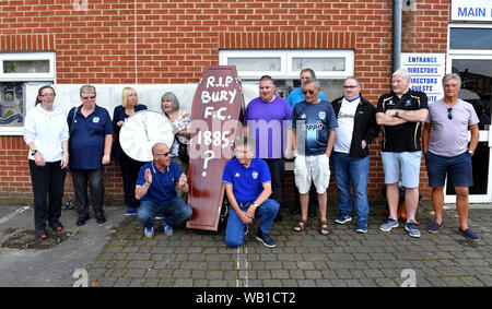 Bury fans deliver a symbolic coffin reading 'R.I.P Bury F.C. 1885 ?' in front of Bury FC Chairman Steve Dale's parking space at Gigg Lane, home of Bury FC. Stock Photo