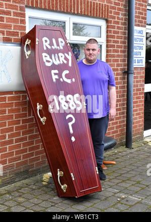 Bury fans deliver a symbolic coffin reading 'R.I.P Bury F.C. 1885 ?' in front of Bury FC Chairman Steve Dale's parking space at Gigg Lane, home of Bury FC. Stock Photo