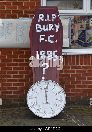 Bury fans deliver a symbolic coffin reading 'R.I.P Bury F.C. 1885 ?' and clock at Gigg Lane, home of Bury FC. Stock Photo