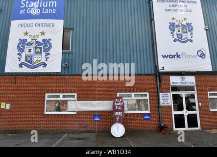 Bury fans deliver a symbolic coffin reading 'R.I.P Bury F.C. 1885 ?' and clock at Gigg Lane, home of Bury FC. Stock Photo