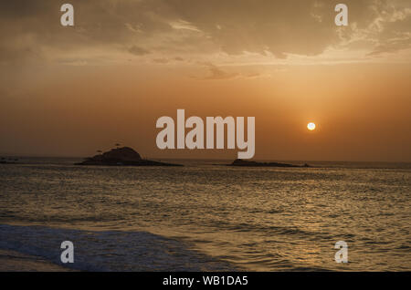 The sunset under the beautiful blue sky on beach Stock Photo