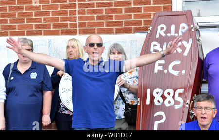 Bury fans deliver a symbolic coffin reading 'R.I.P Bury F.C. 1885 ?' and clock at Gigg Lane, home of Bury FC. Stock Photo