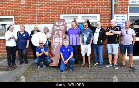 Bury fans deliver a symbolic coffin reading 'R.I.P Bury F.C. 1885 ?' and clock at Gigg Lane, home of Bury FC. Stock Photo