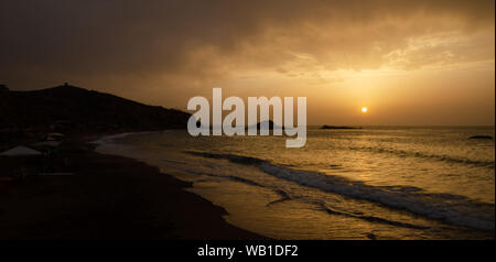 The sunset under the beautiful blue sky on beach Stock Photo