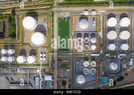 Aerial view oil terminal is industrial facility for storage of oil and petrochemical products ready for transport to further storage facilities. Stock Photo