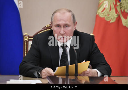 Moscow, Russia. 23rd Aug, 2019. Russian President Vladimir Putin chairs a meeting with members of the Security Council at the Kremlin in Moscow, Russia, Aug. 23, 2019. Vladimir Putin on Friday ordered the government to elaborate measures in response to the U.S. test of a missile previously banned by the Intermediate-Range Nuclear Forces (INF) Treaty. Credit: Xinhua/Alamy Live News Stock Photo