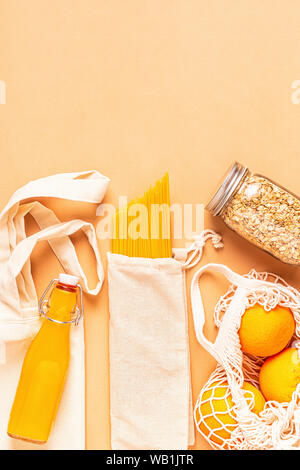 Products in textile bags, glassware. Eco friendly shopping and food storage, zero waste concept. Stock Photo