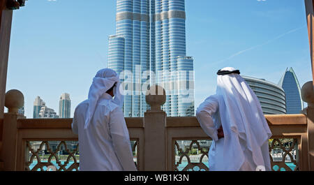 Two anonymous Arab men in traditional white clothing Stock Photo