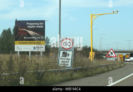 A sign announcing the forthcoming 'smart motorway' on the M4 road in Slough, Berkshire. One of the ways Highways England is increasing capacity is by creating smart motorways. Stock Photo