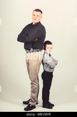team work. happy child with father. business partner. childhood. parenting. fathers day. family day. father and son in business suit. little boy with dad businessman. great team work. Stock Photo