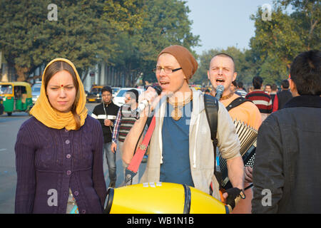 Iskcon temple devotees singing of hymns in praise of Lord krishna at connaught Place Stock Photo