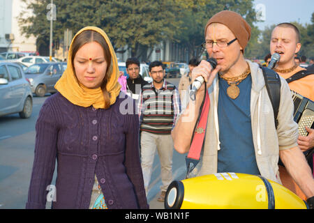 Iskcon temple devotees singing of hymns in praise of Lord krishna at connaught Place Stock Photo