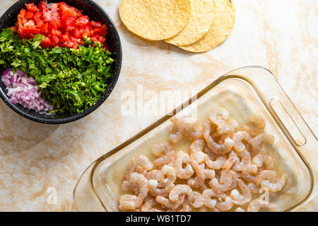 Ceviche, also known as cebiche, seviche and sebiche. Making shrimp ceviche and the ingredients needed for cooking this Latin American seafood dish Stock Photo
