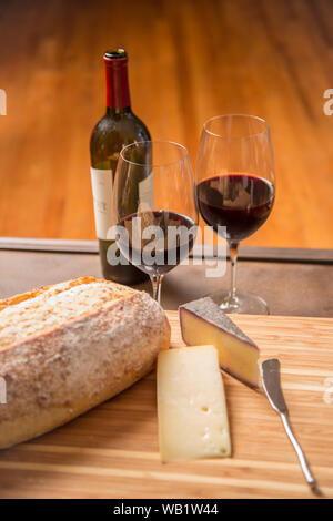 Red wine, bread and cheese vertical Stock Photo