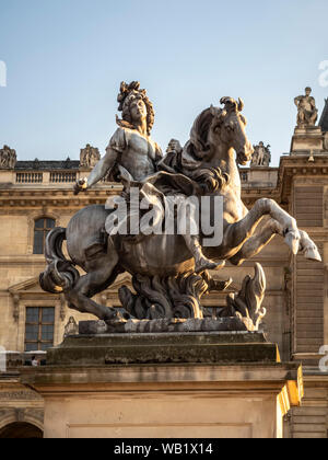 FRANCE, EUROPE - AUGUST 03, 2018:  Equestrian statue of King Louis XIV in the courtyard of the Louvre Museum Stock Photo