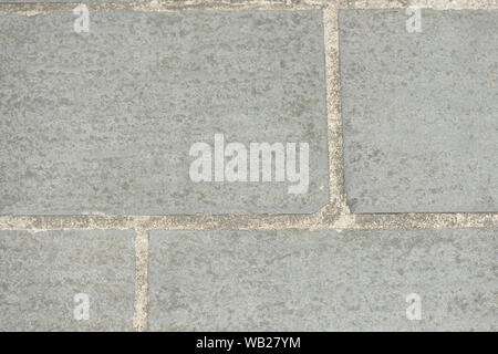 Gray paving slabs closeup, top view. Abstract background Stock Photo