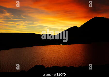 When the sun goes down over Tevno Lake in pirin the pictures are magnificent Stock Photo