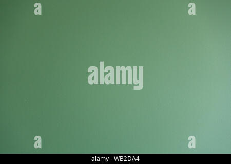 The background is green. Texture plaster in saturated colors. Creative vintage background Stock Photo