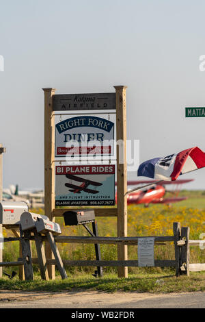 A red Biplane on the field in Martha's Vineyard Stock Photo