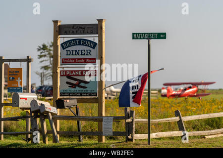 A red Biplane on the field in Martha's Vineyard Stock Photo