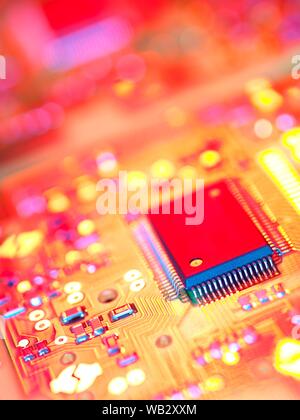 Electronic circuit board containing chips and components. Stock Photo