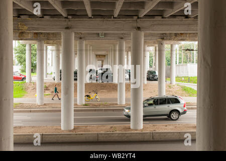 Woman walking under an underpass in Minsk, Belarus. Stock Photo